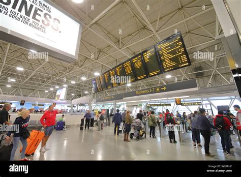 People travel at Gatwick airport train station London England Stock ...