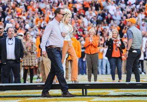 Peyton Manning Walks Dolly Parton Onto Neyland Stadium Field