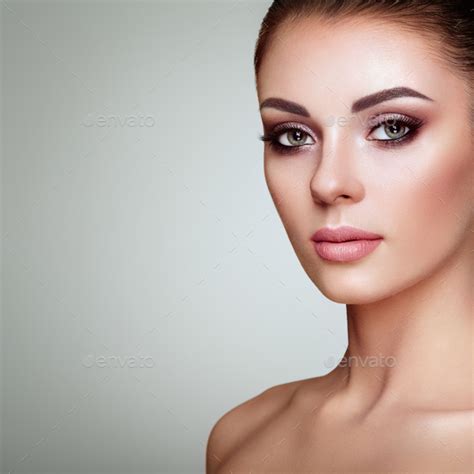 Beautiful woman face with perfect makeup Stock Photo by heckmannoleg