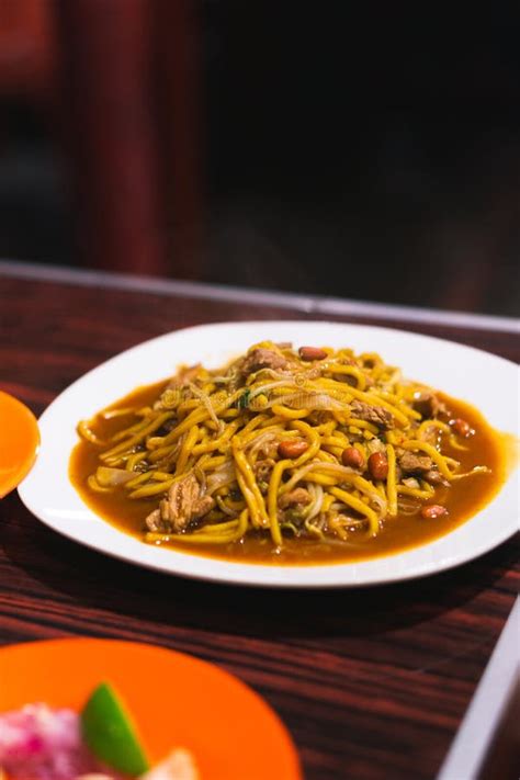 Mie Aceh is Spicy Noodle Cuisine in Indonesia. Yellow Noodles Cooked with Spices, Herb, Squid ...