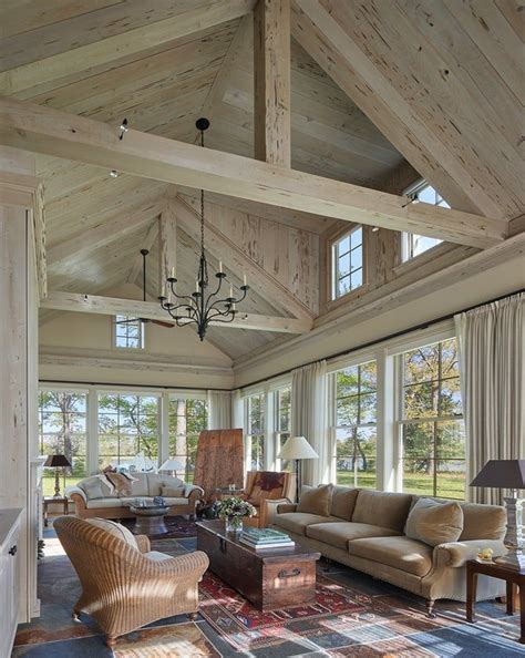 Great room at waterfront estate with beams and paneled cathedral ...