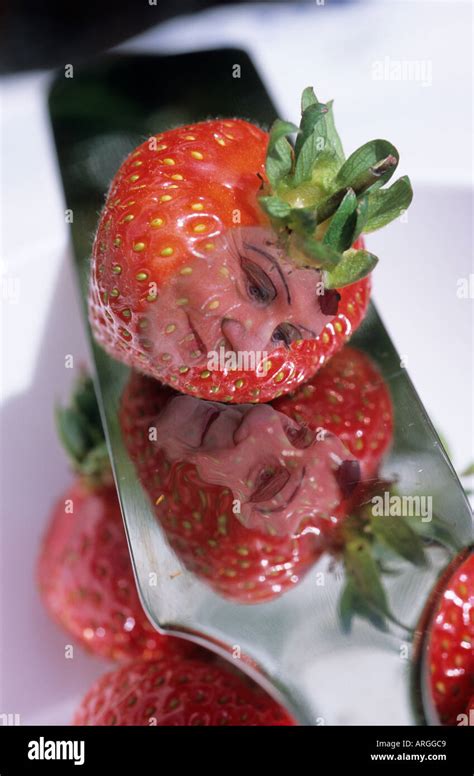 Strawberry with a funny face Stock Photo - Alamy