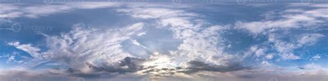 Seamless hdri panorama 360 degrees angle view blue evening sky with beautiful clouds before ...