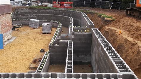 Stepoc Retaining Wall System being... - Anderton Concrete