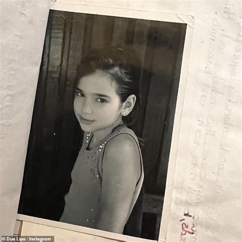 Dua Lipa shares a sweet throwback snap as she uncovers her childhood scrapbook of previously ...