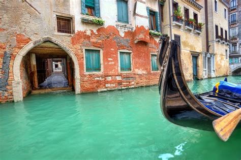 Gondola on small canal in front of ... | Stock image | Colourbox