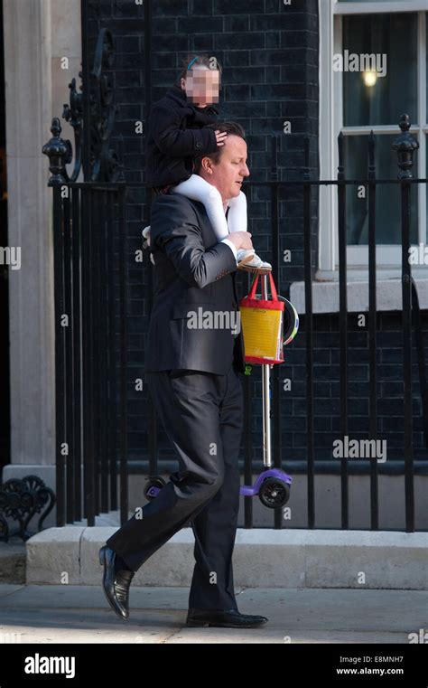 David Cameron leaves Downing Street carrying his daughter Nancy on his shoulders Featuring ...