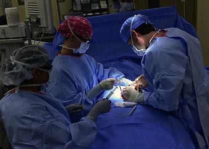 Royalty-Free photo: Person wearing medical mask and teal scrub shirt | PickPik