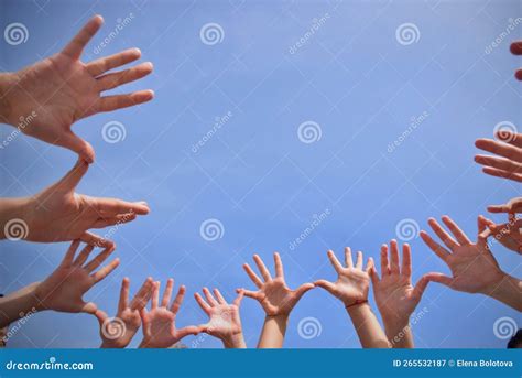 Hands up in the blue sky stock image. Image of sports - 265532187