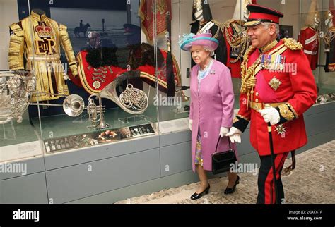 Queen Elizabeth ll looks at exhibits with Lord Guthrie, former Chief of ...