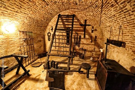 Medieval torture chamber with plenty of tools Photos | Adobe Stock