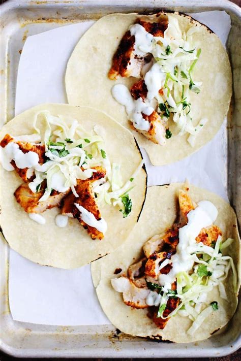 Spicy Fish Tacos With Cabbage Slaw Lime Crema - www.foodess.com