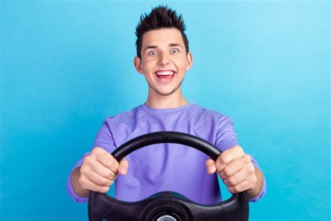 Photo of Man Hold Wheel Play Simulation Game Isolated on Blue Color Background Stock Image ...
