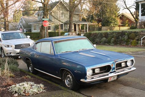 OLD PARKED CARS.: 1967 Plymouth Barracuda.