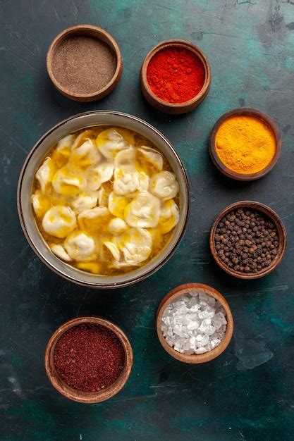 Free Photo | Top view dough soup with different seasonings on dark-blue ...