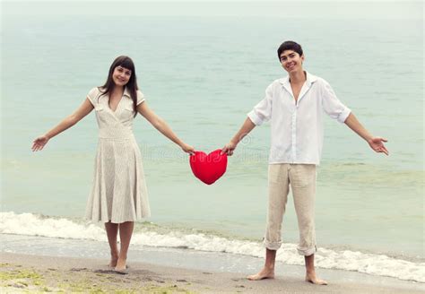 Couple at the Beach with Heart. Stock Image - Image of dawn, caucasian: 25717639