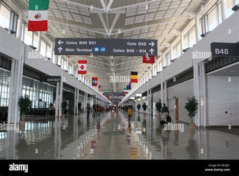 International flags hanging in Concourse B Dulles International Airport Dulles Virginia Stock ...