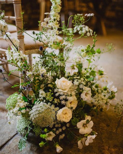 Romantic and seasonal meadow style aisle arrangements | Flower bouquet ...