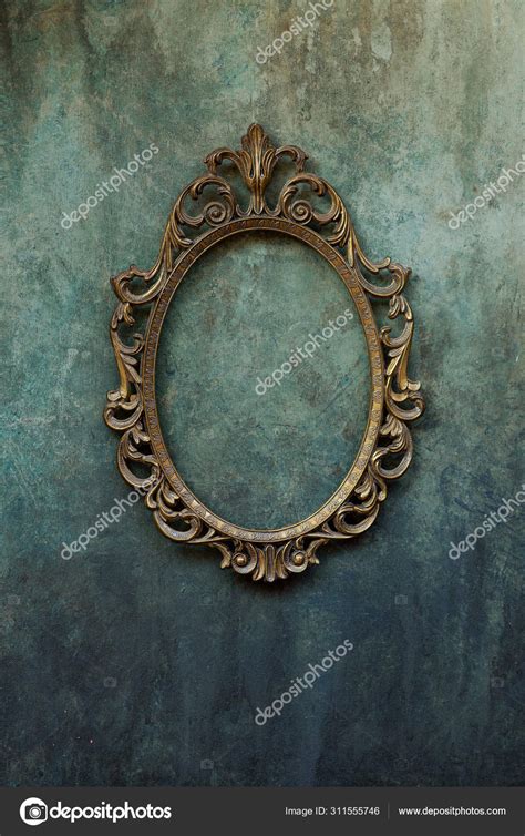 Metal oval frame on a wall Stock Photo by ©Artanika 311555746