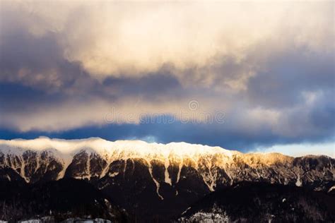 Sunrise Over a Snowy Mountain Peak. Stock Photo - Image of sunrise ...