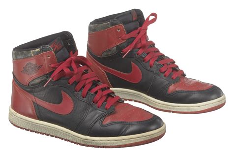 Pair of red and black Air Jordan I high top sneakers made by Nike | Smithsonian Institution
