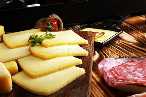 Delicious Traditional Swiss Melted Raclette Cheese Served in Ind Stock ...