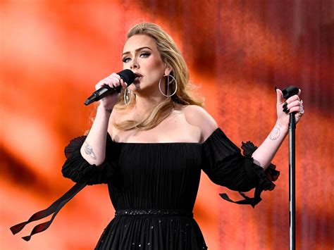 Adele warns fans about throwing things at performers onstage - ABC News