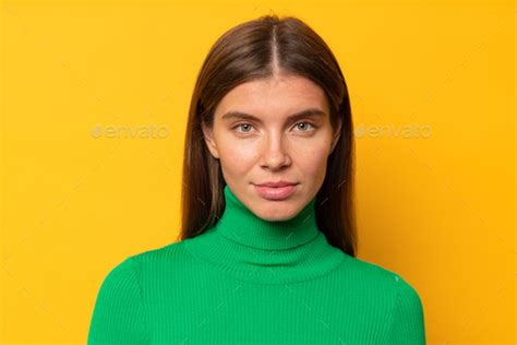 Headshot studio portrait of calm peaceful woman looking at camera on ...