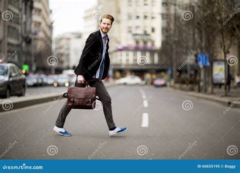 Young Man Walking on the Street Stock Image - Image of adult, city: 60655195