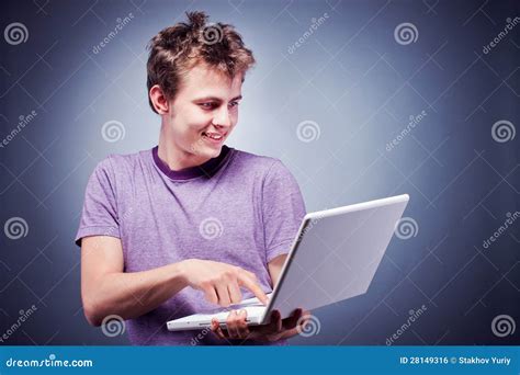 Smiling Young Man Using Laptop Stock Photo - Image of horizontal, shot: 28149316