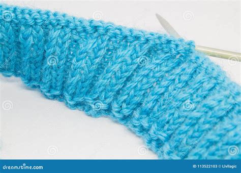 Knitting with a blue wool stock image. Image of fluffy - 113522103