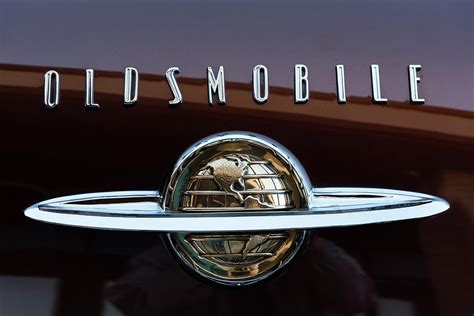 Oldsmobile Emblem Photograph by Robert VanDerWal - Pixels