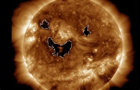 Photo from NASA satellite shows the sun was 'smiling' this week