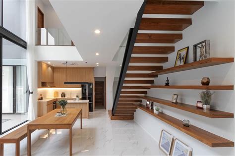 Double story house open interior with wood staircase | Modern prefab homes, Prefab homes, Wood ...