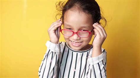 Little girl with glasses smiling 13792420 Stock Video at Vecteezy