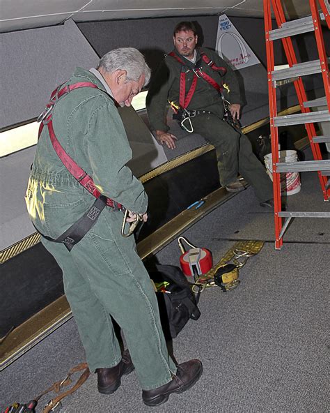Safety First | Chuck Kalert checks his safety harness as Ed … | Flickr