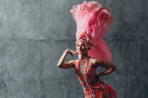 Premium Photo | Three women profile portrait in samba or lambada costume with pink feathers plumage