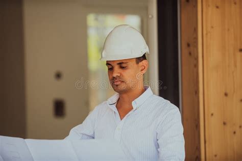 A Architect Looking at Plan and Thinking about Working on Big Project ...