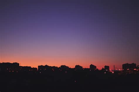 Silhouette of City Buildings during Night Time · Free Stock Photo