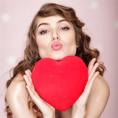 Premium Photo | Beautiful smiling woman with red hearts for st ...