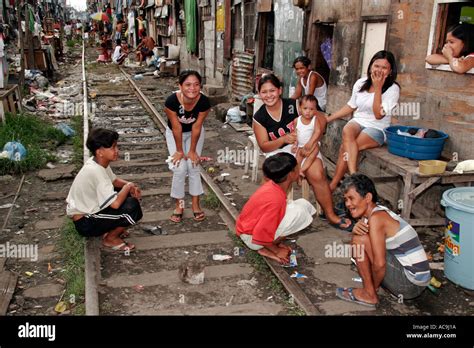 Family group on the tracks in Blumentritt, Manila, Philippines Stock ...