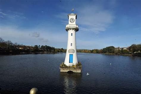 Two people are rescued after a car is accidentally driven into a lake ...