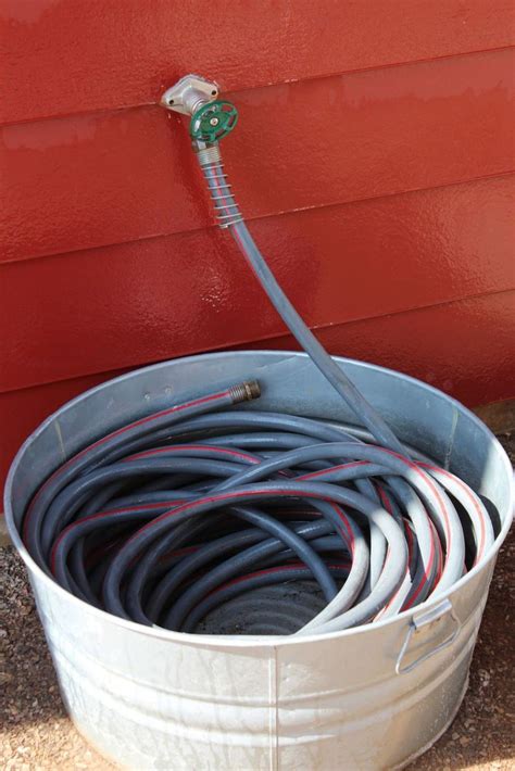 16 Creative Ways to Transform Your Home and Backyard with Stock Tanks | Garden hose storage ...