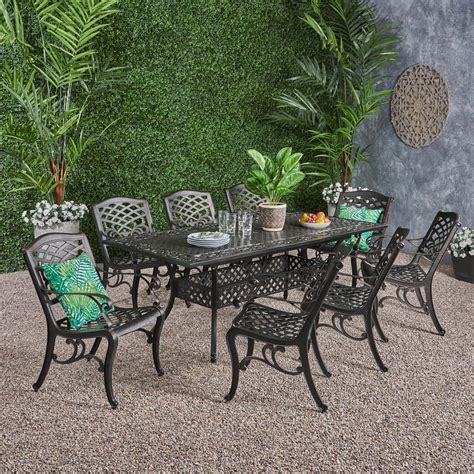 Kinley Outdoor 64 Inch to 81 Inch 9 Piece Cast Aluminum Dining Set with ...