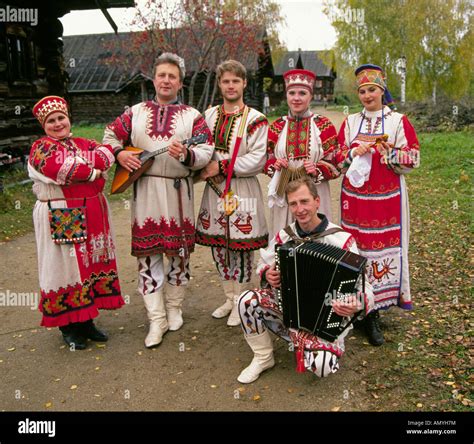 A russian folk music group in traditional clothing in a small remote ...