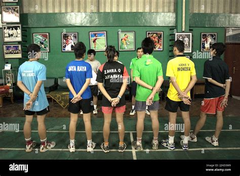 Young badminton players are given instructions during a training ...