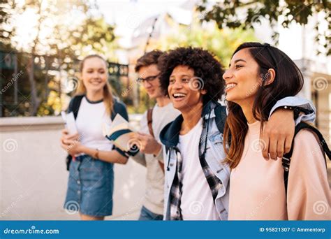 College Students Walking Together Outdoors Stock Image - Image of females, males: 95821307