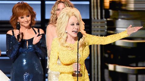 How Dolly Parton Stole The Spotlight At Reba McEntire's Grand Ole Opry Debut