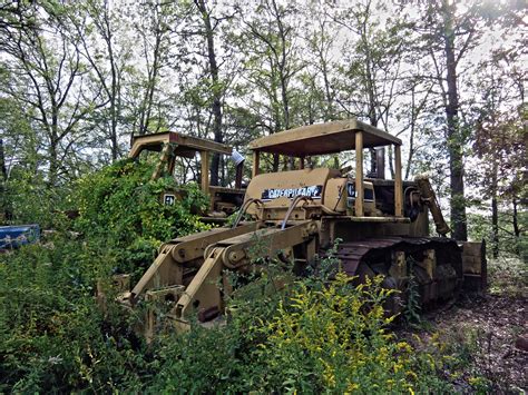 Pair of "forgotten" Caterpillar D9 bulldozers. Ran when parked | Abandoned places, Abandoned ...