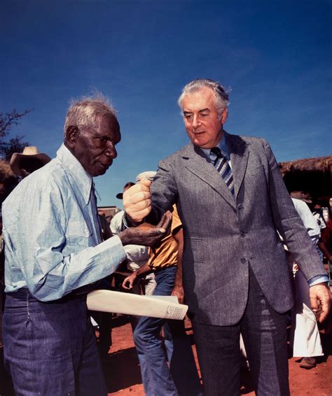 Prime Minister Gough Whitlam pours soil into the hand of traditional ...